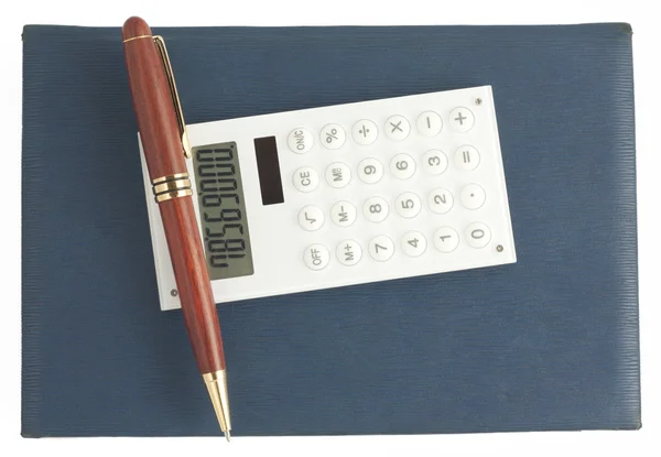 Pióra i kalkulator na niebieski organizator — Zdjęcie stockowe
