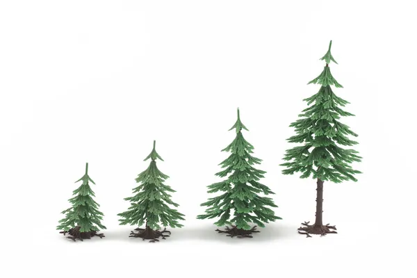 Čtyři plastové kožešin stromy na bílém pozadí — Stock fotografie