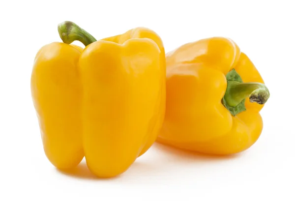 Δύο κίτρινες πιπεριές σε άσπρο φόντο — Φωτογραφία Αρχείου