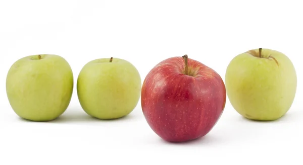 Red apple ahead of the green on white — Stock Photo, Image