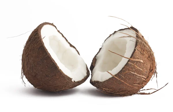 Två kokos halvor på vit — Stockfoto
