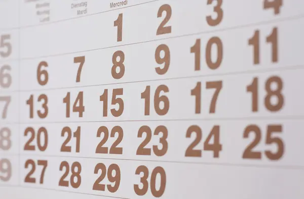 Calendar page with brown figures — Stock Photo, Image