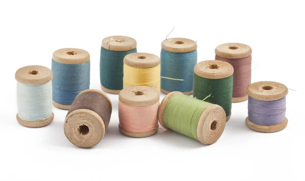 Wooden multicolored thread coils — Stock Photo, Image