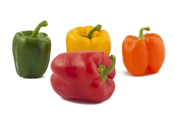 Green, yellow, orange and red peppers — Stock Photo, Image