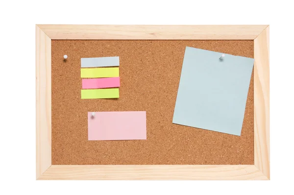 Corkboard with empty blue pink and yellow notes — Stock Photo, Image