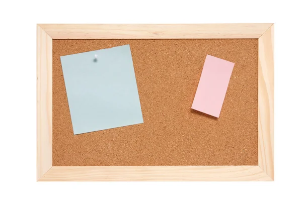 Prikbord met lege blauwe en roze notes — Stockfoto