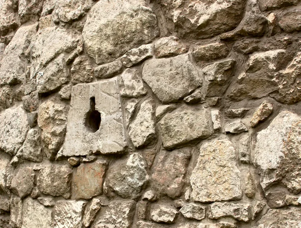 Ancient stone wall with loopholes — Stock Photo, Image