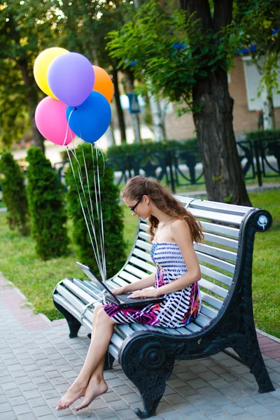 Girl with notebook and balls — Stock Photo, Image