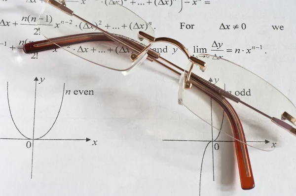 Glasses on formulas — Stock Photo, Image