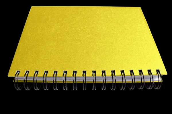 Caderno de ouro espiral isolado em preto — Fotografia de Stock