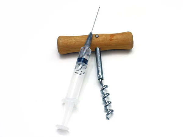 Syringe and corkscrew — Stock Photo, Image