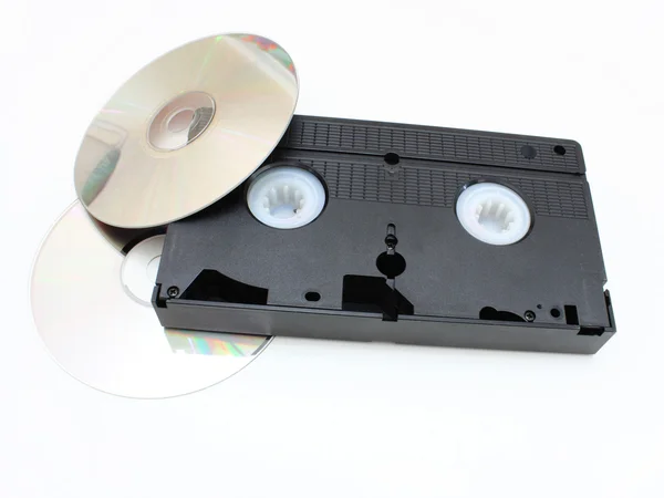 DVD диски и VHS видео картридж — стоковое фото