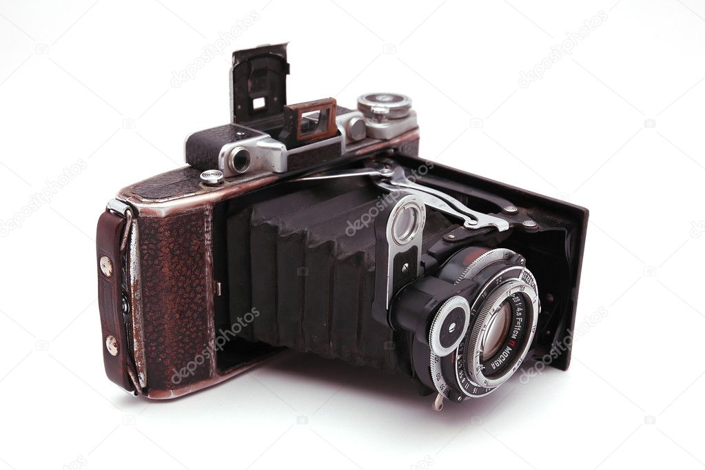 Old roll-film camera on white