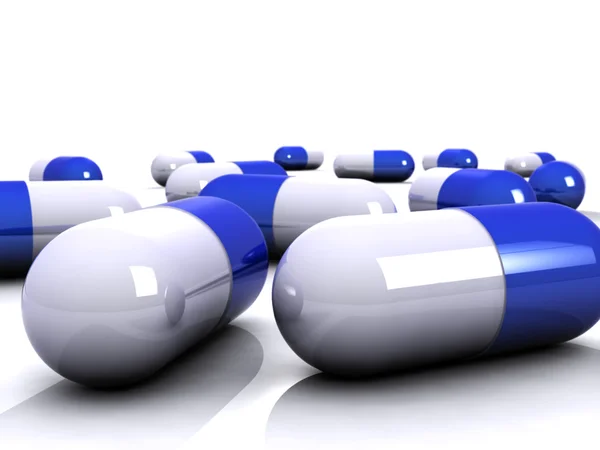 White / blue Pills — стоковое фото