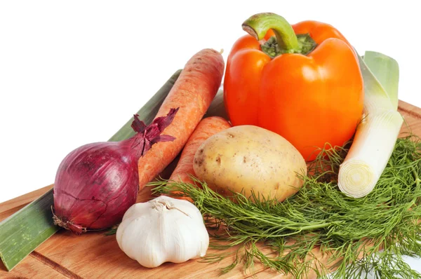 Vegetables on a wooden kitchen board — Stock Photo, Image