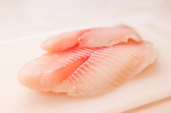 Fillet of fish on a kitchen board — Stock Photo, Image