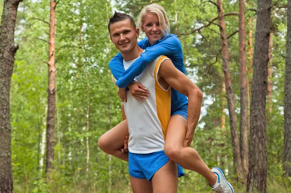 Sportsmen. The young man and the girl — Stock Photo, Image