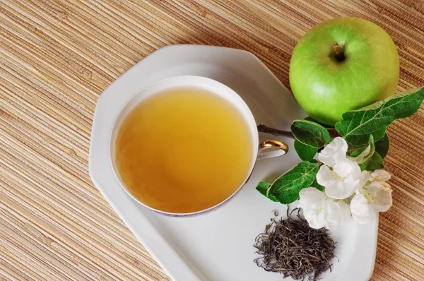 Still-life with green tea and an apple — Stock Photo, Image
