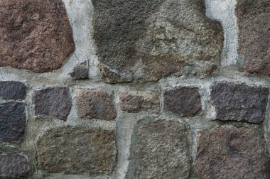 Brick wall with big and small stones clipart