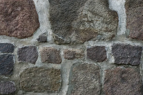 stock image Brick wall with big and small stones