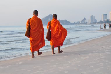 Two Monks on Hua Hin beach,Thailand clipart