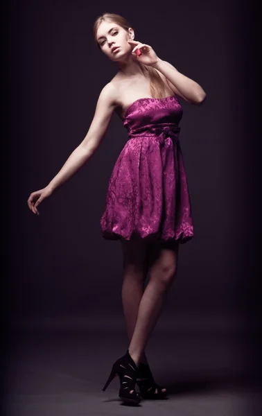 stock image Beautiful young woman wearing pink dress and high heels