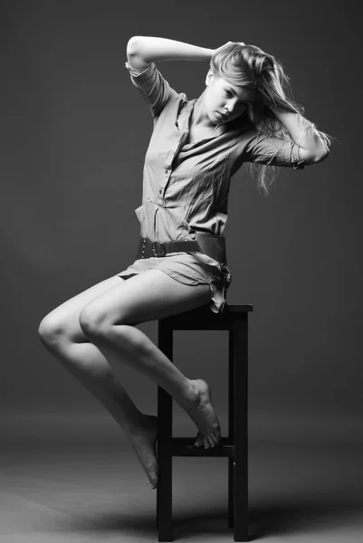 stock image Black and white shot of girl sitting on chair