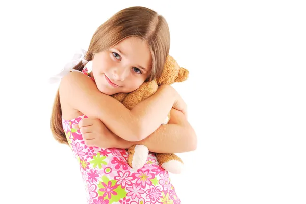 Kleine meisje nemen teddybeer — Stockfoto