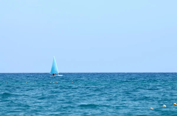 stock image A small boat sailing on a sunny day