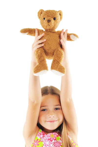 Little girl playing with bear toy — Stock Photo, Image