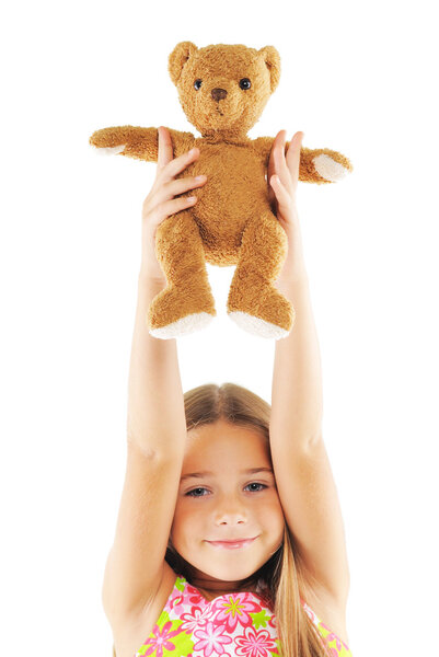 Little girl playing with bear toy