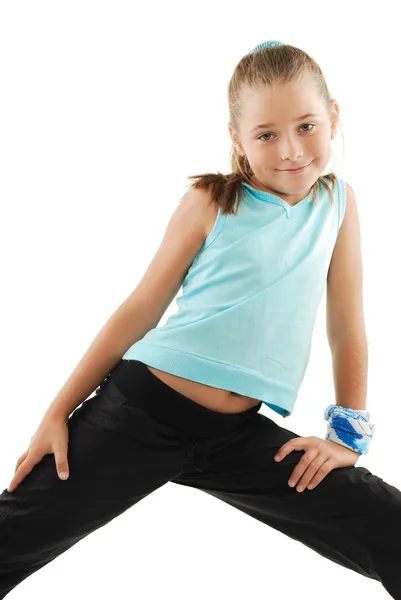 Маленькая девочка в синем спортивном костюме — стоковое фото