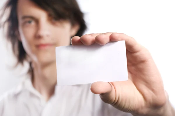 stock image A young man holding a business card