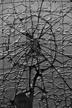 Hole with cracks in the reinforced glass clipart