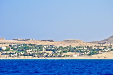 View at the Egyptian coast from the board of the yacht clipart