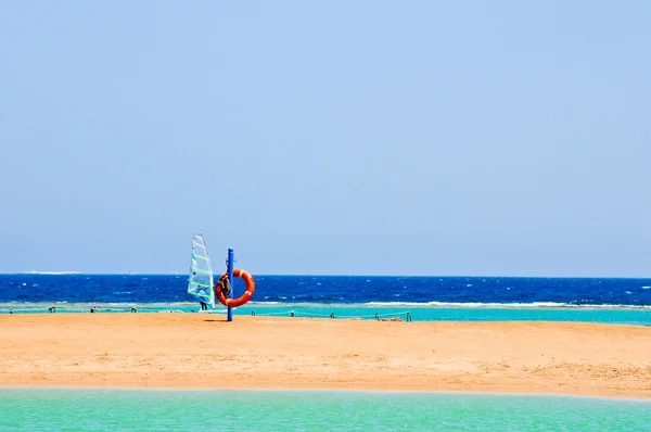 Windsurfer in the sea and life buoy on the beach of Egypt — Stock Photo, Image