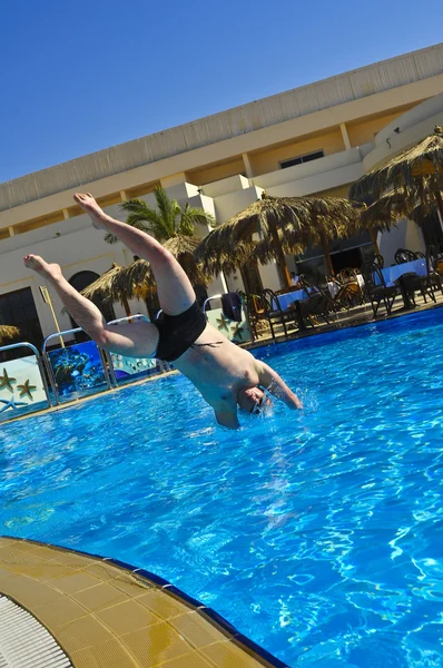 stock image The Russian guy madly dives into pool