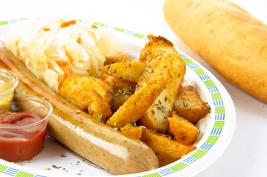 Sausages, fried potatoes, sauerkraut and bun clipart