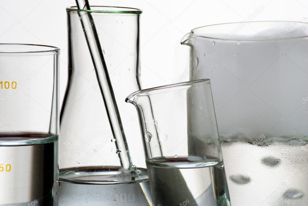Laboratory glassware during experiment and vapors over liquid