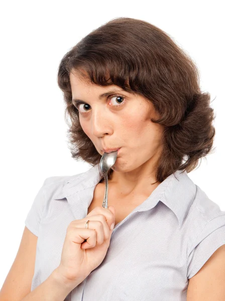 Pretty girl licks the spoon — Stock Photo, Image