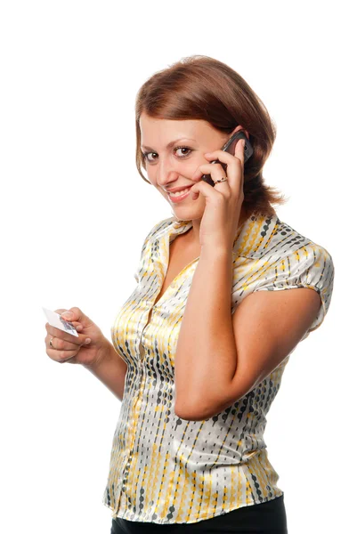 Menina com um telefone celular e um cartão de crédito — Fotografia de Stock