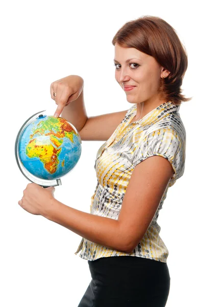 Smiling girl shows on the globe — Stock Photo, Image