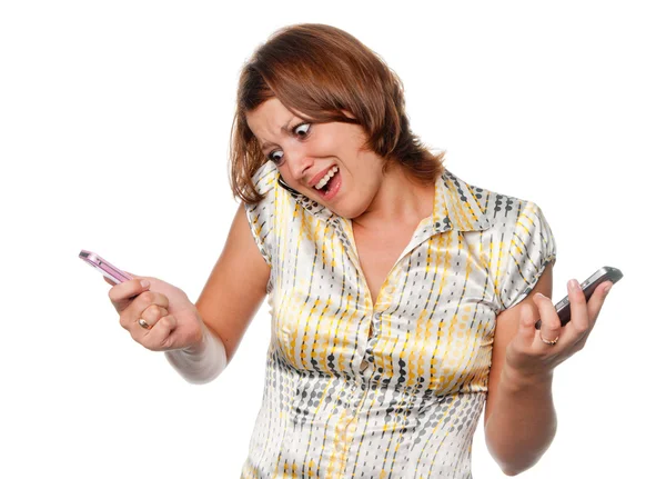 Very angry girl and three mobile phones — Stock Photo, Image