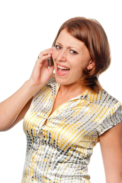 Emotionele meisje spreekt door een mobiele telefoon Stockfoto