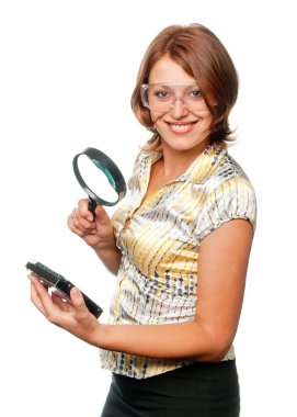 Smiling girl considers hard driver through a magnifier clipart