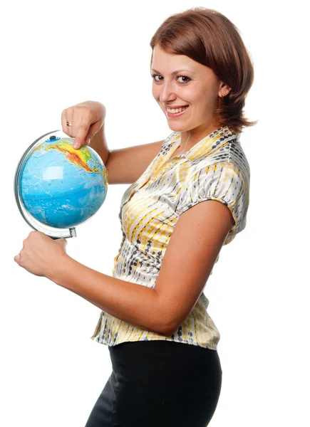 Smiling girl shows on the globe — Stock Photo, Image