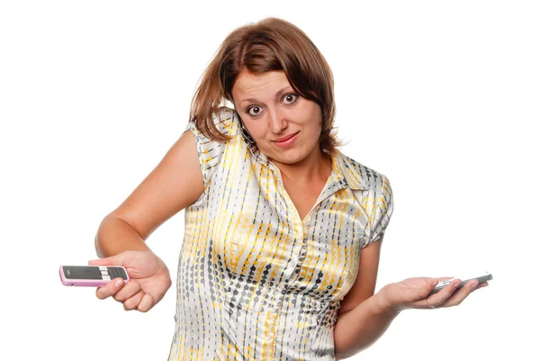 Meisje gesprekken tegelijk door drie mobiele telefoons — Stockfoto