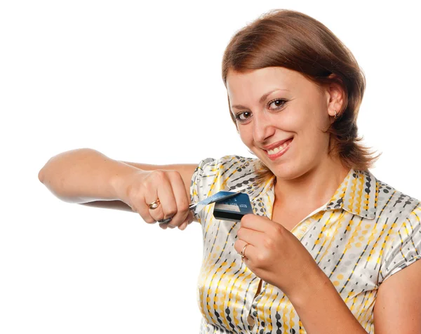 Souriante fille coupe une carte de crédit, refus de crédit — Photo