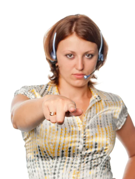 Menina com fones de ouvido e um microfone aponta um dedo — Fotografia de Stock