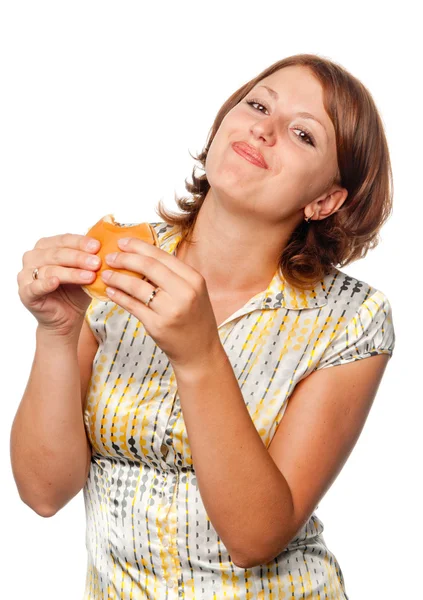 Girl eats a hamburger — Stock Photo, Image
